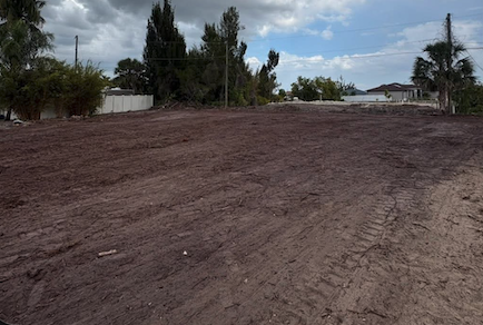 Cleared and graded residential lot leveled to smooth dirt, ready to build, in Cape Coral, FL